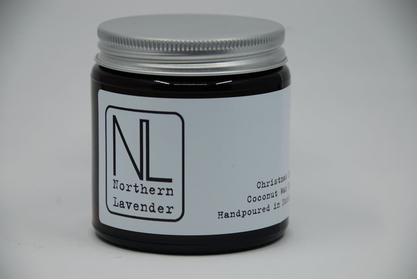 Northern lavender branded christmas spices coconut wax candle in a small amber glass jar with a silver aluminium lid
